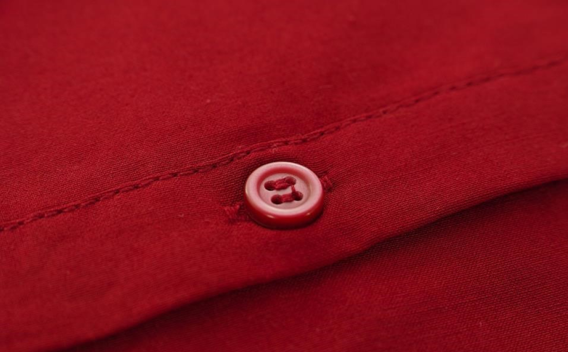 close-up-of-red-button-on-red-shirt
