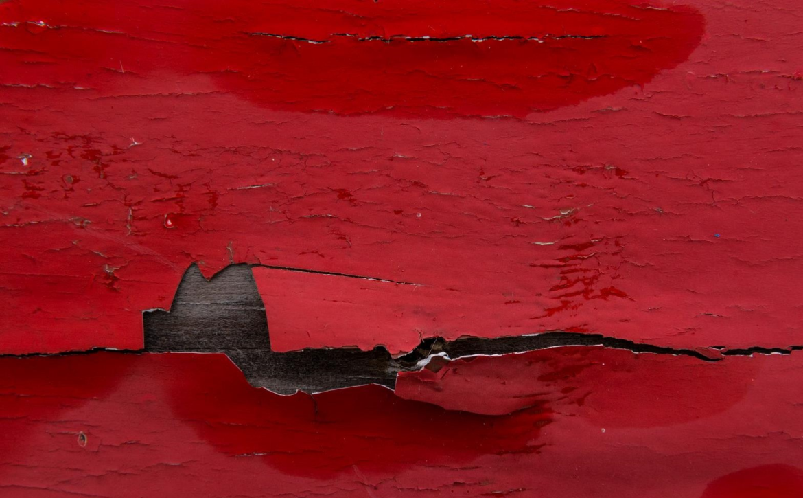 closeup-of-peeling-red-paint-on-boat
