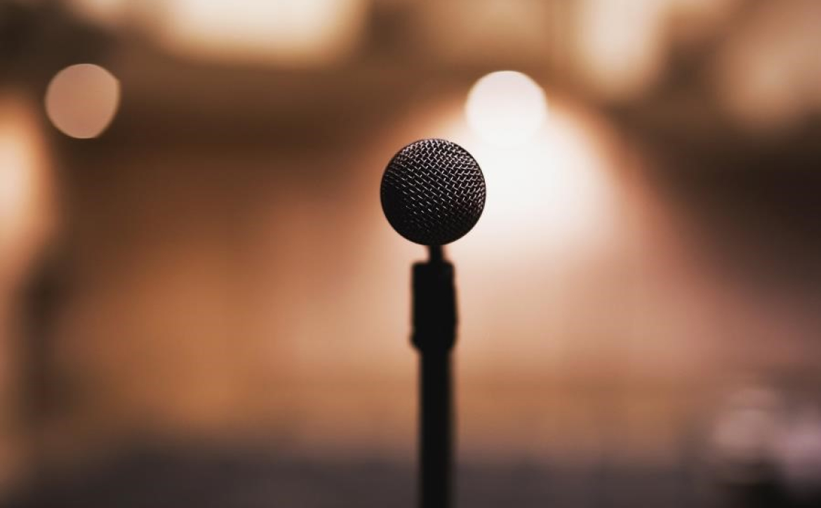 abstract-photo-taken-behind-microphone-looking-into-audience