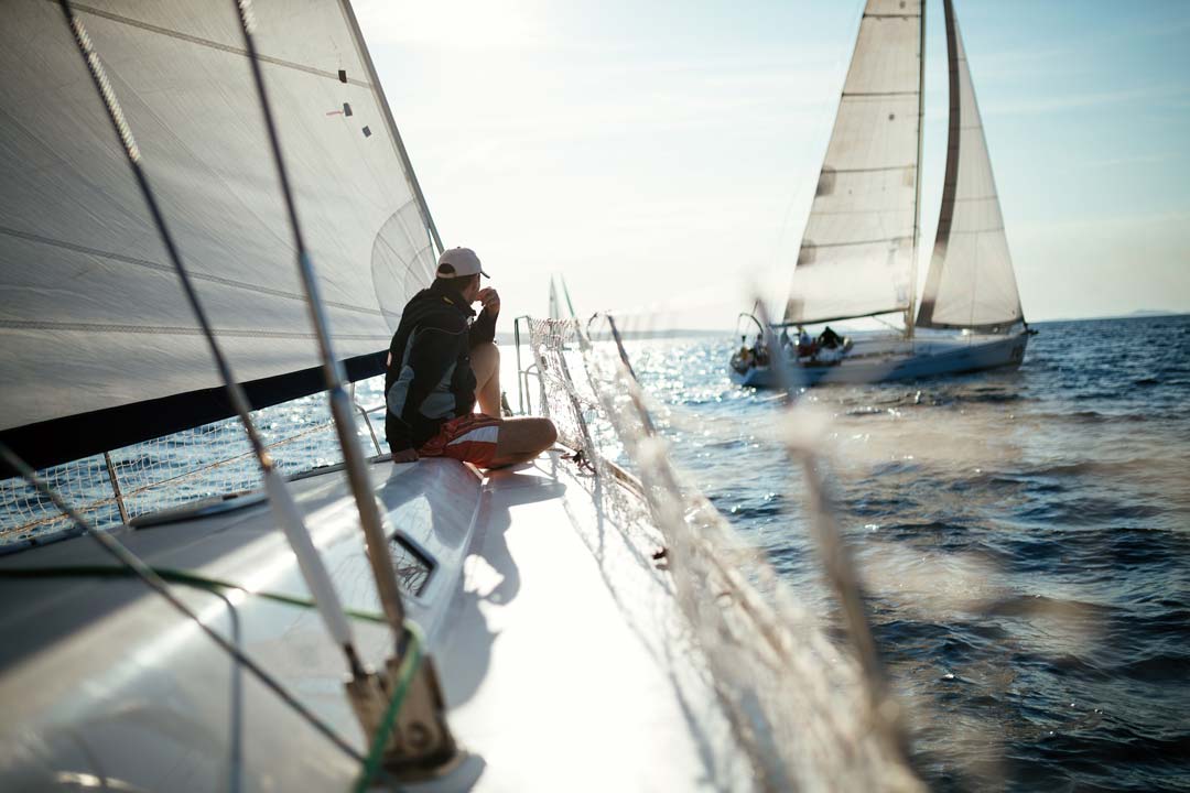 a man relaxing on a sailboat